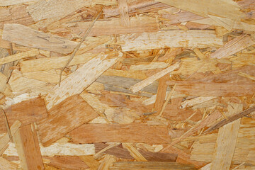 OSB wood chips pressed sheet structure, abstract empty backdrop, close up