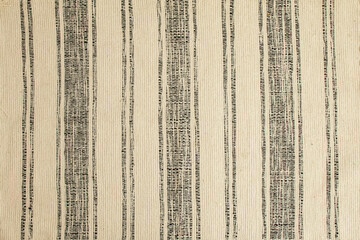 Rustic retro patterned rug or carpet, abstract textured backdrop, flat lay close up
