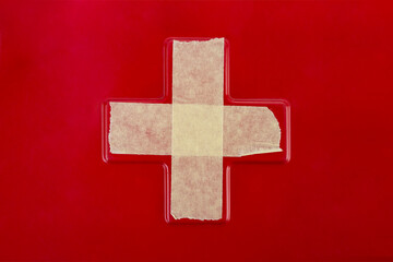 Paper masking tape closs on red background close up