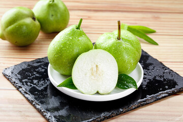 Fresh Green Pears from Shaanxi Province China - Whole and Sliced Fruit Display on Slate Board