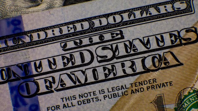 US currency and key symbols on American dollar bills, close-up.