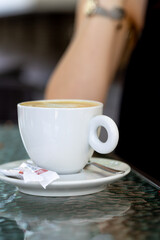 Coffee cup on a table in a cafe