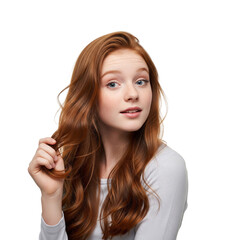 Fototapeta premium Curious young redhead girl with bright blue eyes, gently touching her wavy hair, conveying innocence and wonder