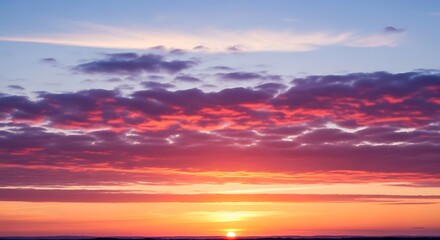 Obraz premium Vibrant Sunset Sky with Fiery Clouds Over Horizon.
