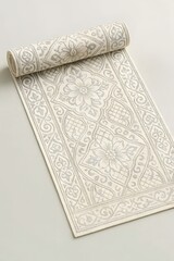 Fototapeta premium Rolled-up elegant runner rug with ornate floral and arabesque pattern in neutral beige tones