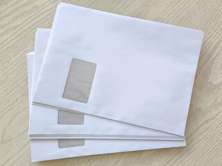 White postal envelopes with address window