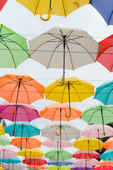 colorful beach umbrella. Colored umbrellas. Sky of colored umbrellas. Decor of umbrellas.