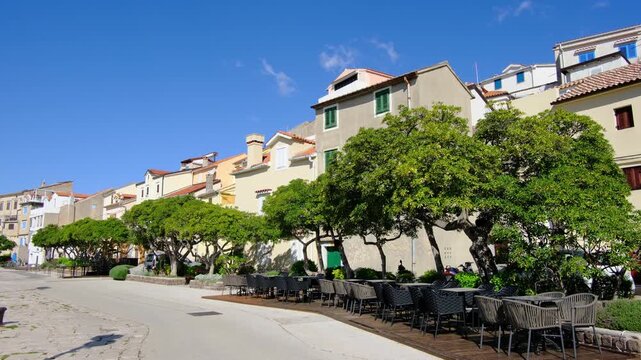 Krk, Croatia - March 30 2025. Beautiful old houses near harbor town Baska on Krk island in Primorje-Gorski Kotar County of western Croatia