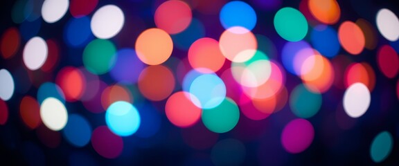 Fototapeta premium Vibrant colorful blurred bokeh lights creating an abstract festive background effect with soft focus
