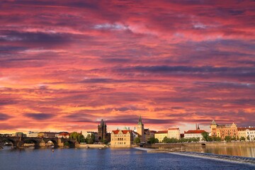 Obraz premium Skyline of River Vltava riverfront and Old Town (Stare Mesto) in Prague city, Czech Republic. Sunset light.
