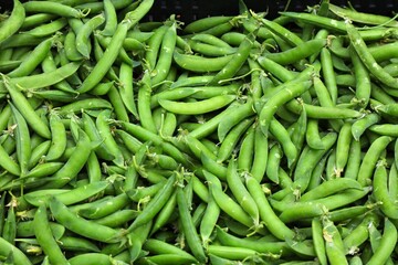 Vegetables at a local food market in Vinohrady district in Prague, Czech Republic. Green sweet pea.
