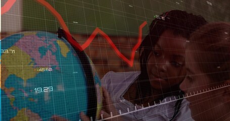 Schoolgirls leaning and pointing at terrestrial globe in classroom, with data overlay and red chart