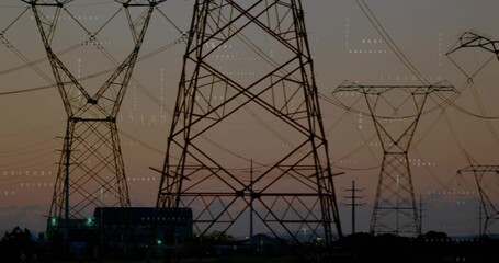 Dominating steel lattice tower standing with power lines above substation at dusk, binary overlay