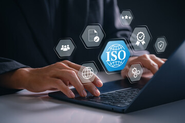 Quality certification standards with ISO compliance shown by business professional using laptop in office workplace for audit process, global assurance, document validation and corporate governance