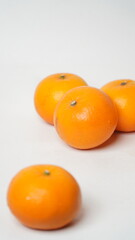 Isolated white Wokam Orange or often known as Mandarin Orange which is still fresh with bright orange skin.