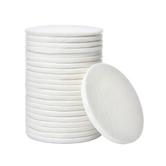 Obraz premium A clean stack of white round cotton pads is neatly piled, with one pad leaning, isolated on a transparent background.
