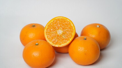 Isolated white Wokam Orange or often known as Mandarin Orange which is still fresh with bright orange skin.