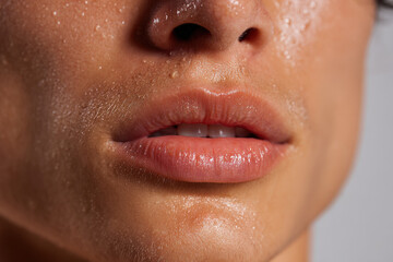 closeup of lips tightly pressed together from physical exertion embodying struggle for victory