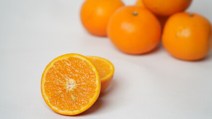Isolated white Wokam Orange or often known as Mandarin Orange which is still fresh with bright orange skin.