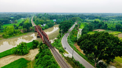 Railway bridge over small river.