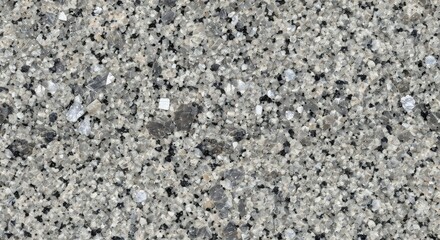 A closeup view of a granite surface with speckled gray black and white grains