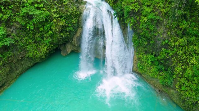 Aerial view of Cabello de Angel waterfall cascading into a turquoise pool, surrounded by green tropical vegetation in Panama.
