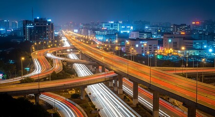 Obraz premium Cityscape at Night with Highway and Traffic.