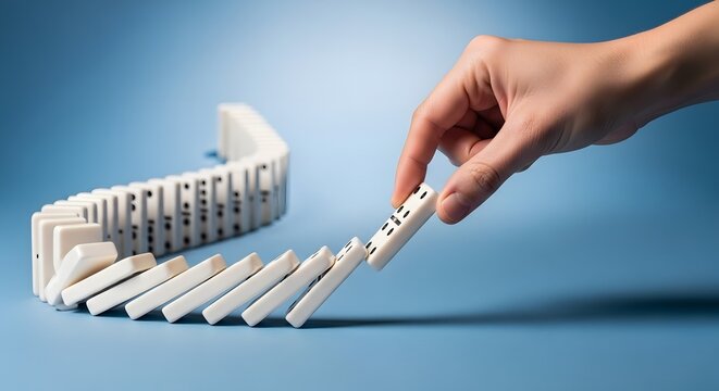 Domino Effect, Hand Starting Chain Reaction, Risk Management Concept