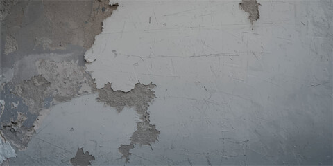 An aged concrete wall with a blank, grey grunge texture, perfect for a vintage backdrop or wallpaper design