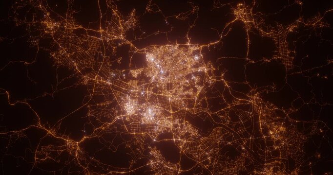 Gwangju (South Korea) aerial view at night. Top view on modern city with street lights. Camera is zooming out, rotating counterclockwise. Vertical video. The north is on the left side