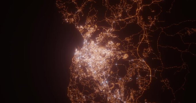 Tangier (Morocco) aerial view at night. Top view on modern city with street lights. Camera is zooming out, rotating clockwise. Vertical video. The north is on the left side