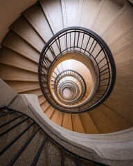 A mesmerizing view from above showcases a spiraling staircase design.