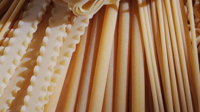 Pasta mix, different Italian tagliatelle fussili pasta packaging window, Fettuccine pasta, close up, not cooked