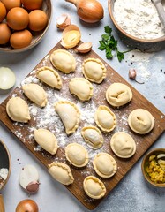 Uncooked dumplings on a wooden board