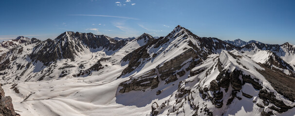 This scenic spring mountain panorama near Crested Butte, Colorado, features snow-covered Elk Range 13ers Golden Tops, Cassi Peak, and Precarious Peak. © Nick Monitello