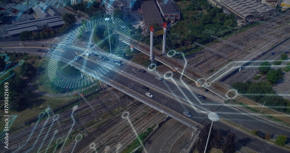 Poster displaying cable-stayed bridge carrying cars over railway tracks in transit hub with data overlays