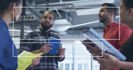 Discussing data man wearing plaid shirt and headphones holding notebook in office with UI overlay