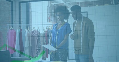 Reviewing partners comparing swatches using measuring tape in fashion studio with rack data overlay