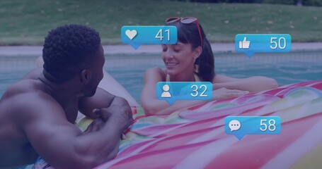 Leaning adult couple in swimwear chatting poolside in backyard, with swirl float and reaction icons