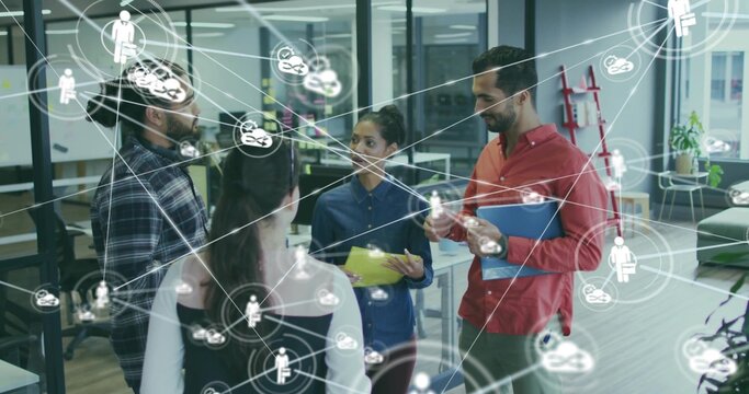 Collaborating team of five discussing project in office, with colored folders and network icons - Powered by Adobe