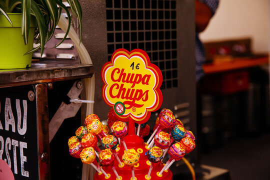 Villach, Austria - July 30, 2025: Colorful Chupa Chups lollipops displayed at a vibrant festival stall, showcasing sweet treats and festive atmosphere at Villacher Kirchtag event