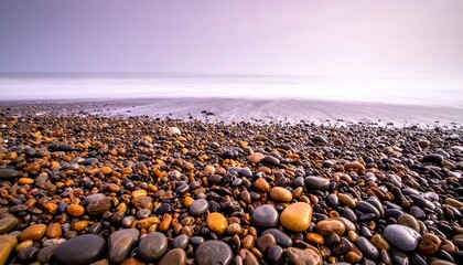 Pebble Beach Serenity - A Coastal Landscape of Smooth Stones and Calm Waters.