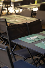 Outdoor restaurant tables and chairs waiting for customers