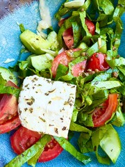 Freshly made Mediterranean salad on plate.