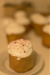 Close-up of traditional Easter bread kulich, freshly baked at home. Warmth and joy of homemade holiday treats. Family celebration, and the time-honored ritual of preparing Easter pastries with love.