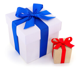 Gift boxes with blue and red ribbon bows isolated on white background