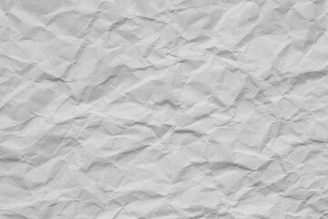 Close-up macro of crumpled white paper background,Wrinkled and crumpled white paper texture. Perfect as a background for design, art, and creative projects.