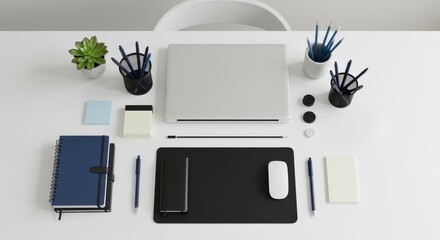 A clean, modern workspace layout, featuring a laptop, notebooks, pens, pencils, and notepads, arranged neatly on a white table.