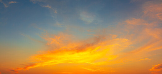 Clouds and orange sky backdrop,Beautiful Vivid sky painted by the sun leaving bright golden shades.