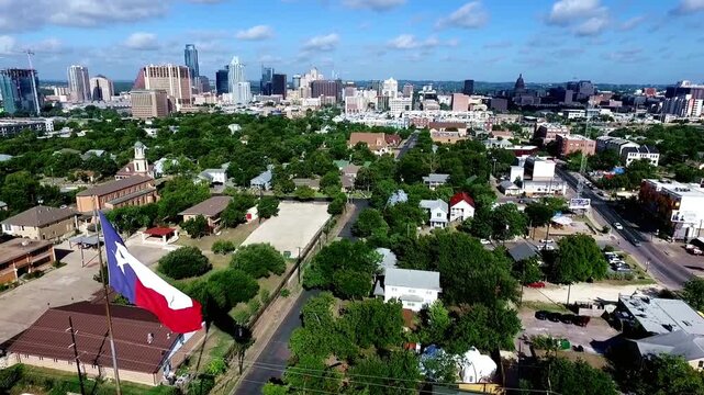 Aerial view of austin texas neighborhood with downtown skyline in background